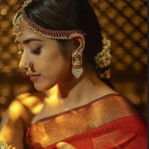 Best Bridal Makeup Artist in kerala with a red model girl