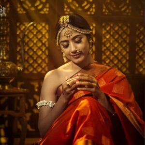 Best Bridal Makeup Artist in kerala with a red model girl